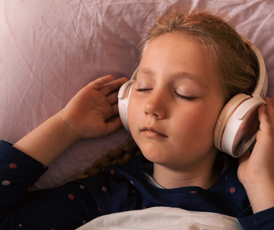Peaceful child sleeping beneath stars, symbolising the calming bedtime routine supported by The Sleep Rescue Kit’s audiostory, meditation recording, yoga, breathwork and science based sleep tools